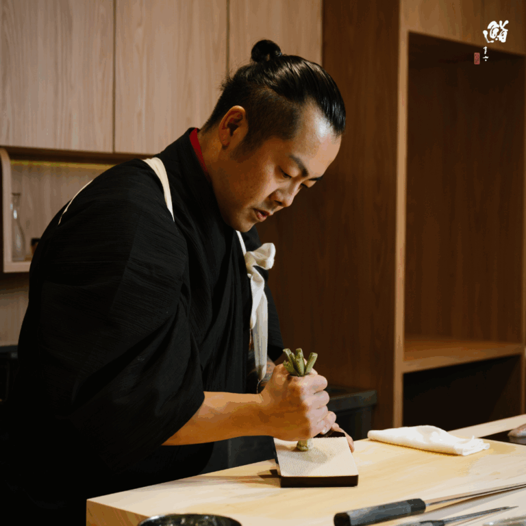Sushi Masa by Ki-setsu - Chef Masa preparing wasabi for omakase dinner service in Singapore restaurant.