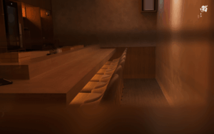 Best Omakase Singapore : Minimalist omakase counter with wooden interiors and soft ambient lighting