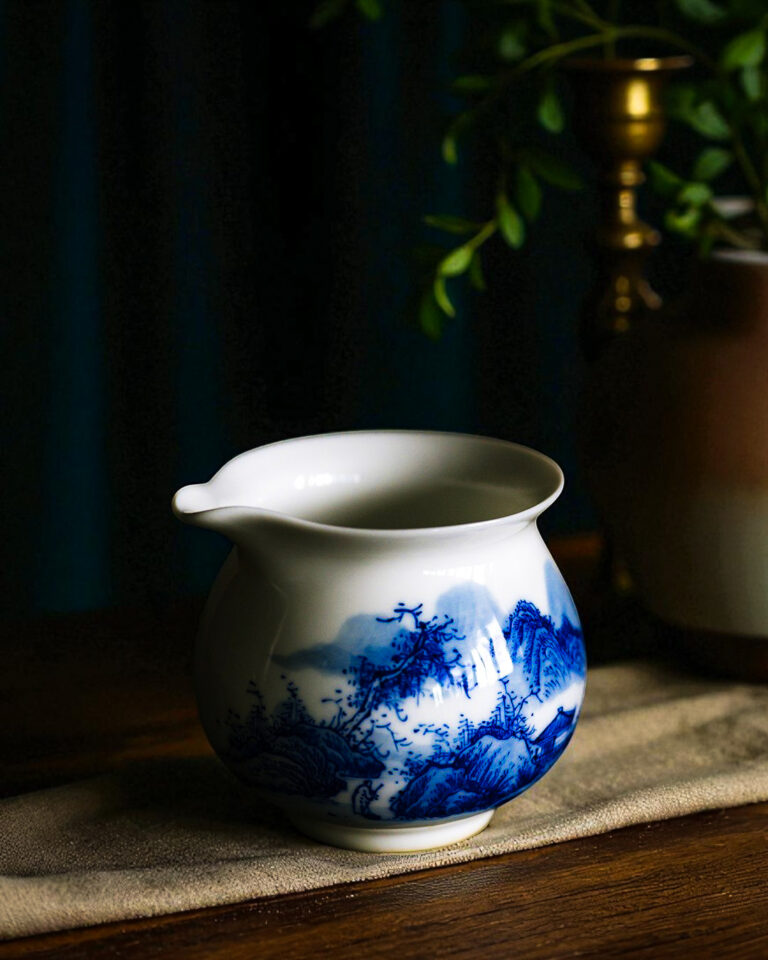 Tea Room Singapore – delicate tea cups and teapots set on polished wooden tables, creating a perfect setting for tea appreciation.