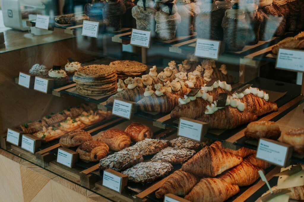Best Cafe in SG : Cozy cafe interior with pastries on display