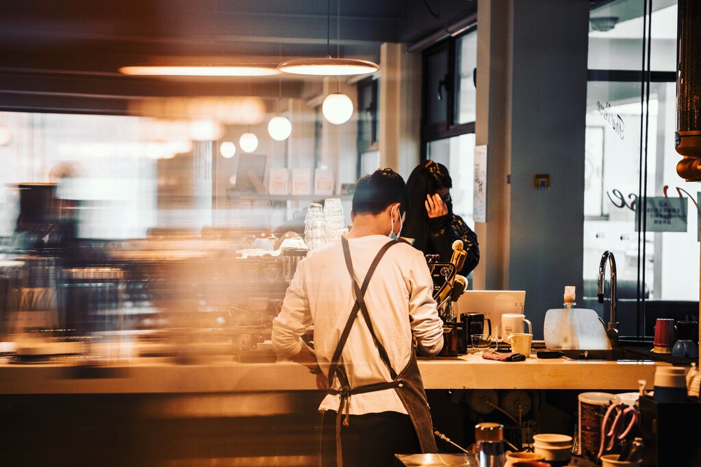 Best Cafe in SG : Cafe interior featuring barista and state-of-the-art coffee equipment