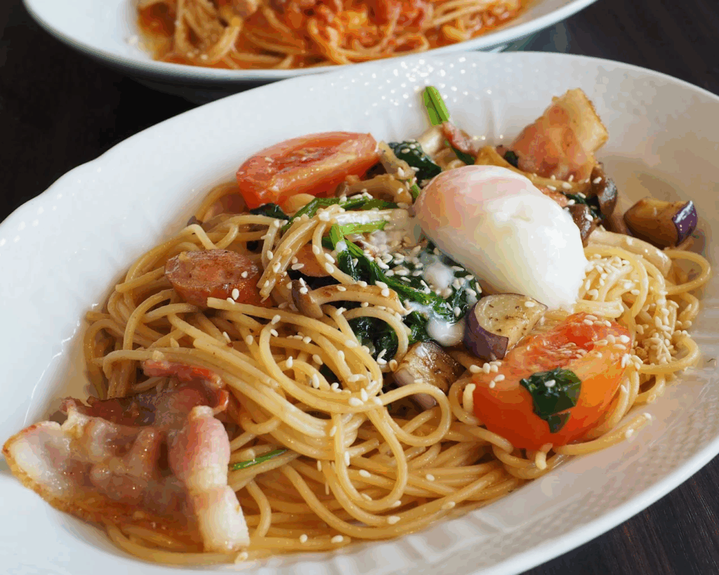 Beyond the Orchard Road : Colourful Japanese-inspired bowl dish featuring noodles, tomatoes, and seared mackerel.