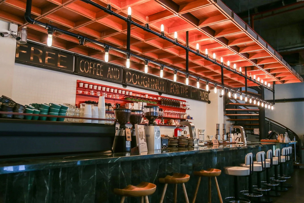 Best Coffee in SG : The iconic CMCR interior—industrial yet cosy—where premium beans meet friendly service, making it a favourite destination for both serious coffee drinkers and casual brunch-goers in Singapore.