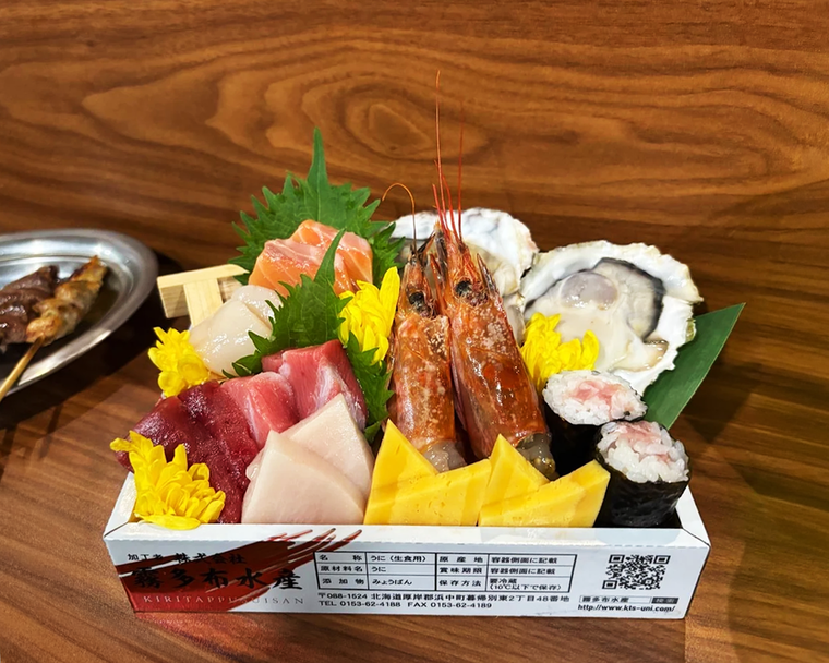 Fortune Centre Food: A beautifully arranged sashimi box from Sakedokoro Eizaburo, featuring vibrant cuts of tuna, salmon, and yellowtail, showcasing the freshness and precision of Japanese craftsmanship.