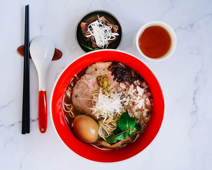 Beyond the Orchard Road : A refined bowl of Tsuta Japanese soba noodles served in a minimalist Japanese setting, highlighting the delicate noodle texture, aromatic broth and elegant presentation that reflects traditional Japanese craftsmanship