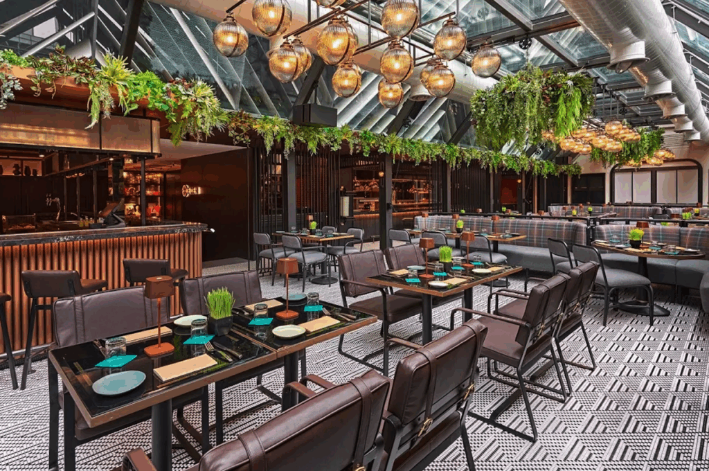 picture Orchard Road Food : Modern dining experience at Eden Restaurant, surrounded by greenery and natural light.