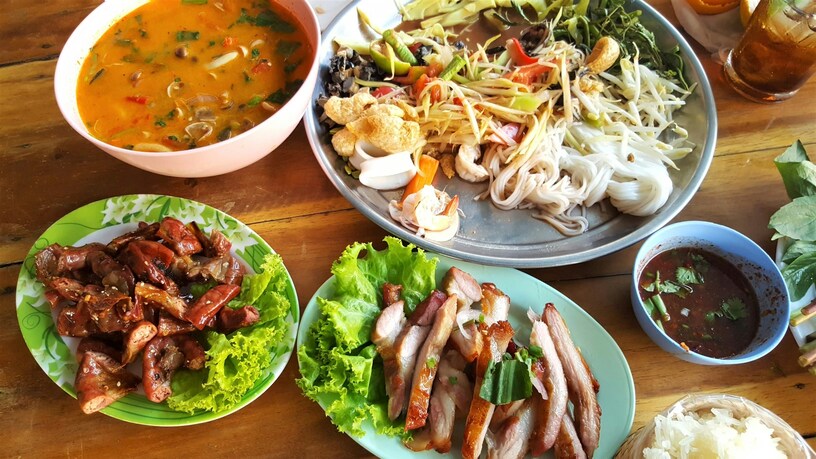 Orchard Plaza Food : Diners enjoying authentic Thai dishes in a relaxed, homely setting.