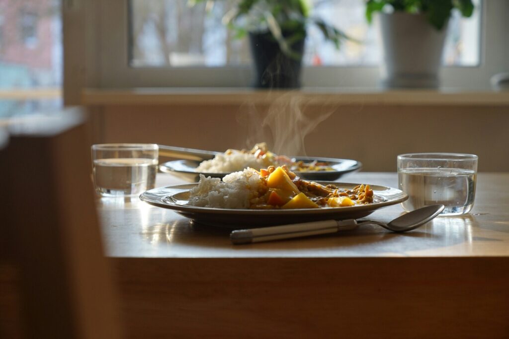 Japanese Curry : Plated curry filled with rich Japanese curry beside fluffy rice.