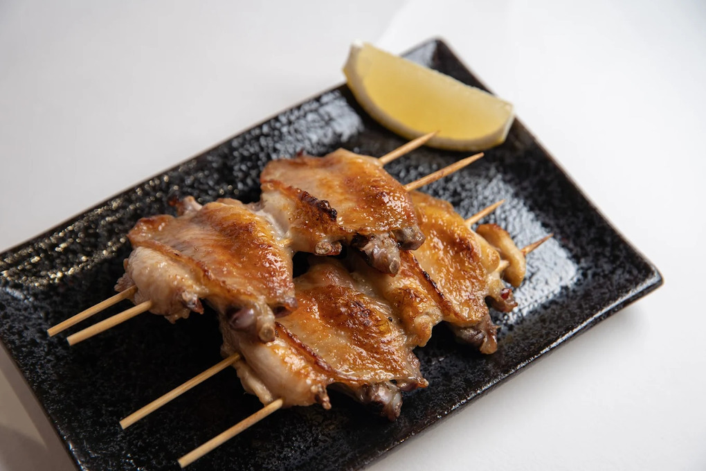 Fortune Centre Food: Close-up of smoky, caramelised skewers fresh off the grill, highlighting the craftsmanship behind Fortune Centre’s hidden Japanese bars.