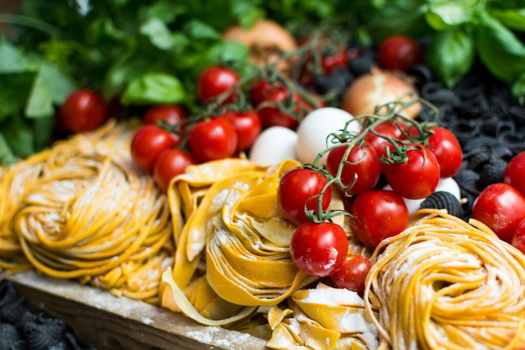 Close-up view of freshly handmade pasta, carefully prepared from scratch with soft, silky dough ready to be cooked to perfection.