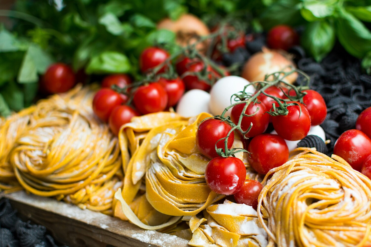 Close-up view of freshly handmade pasta, carefully prepared from scratch with soft, silky dough ready to be cooked to perfection.