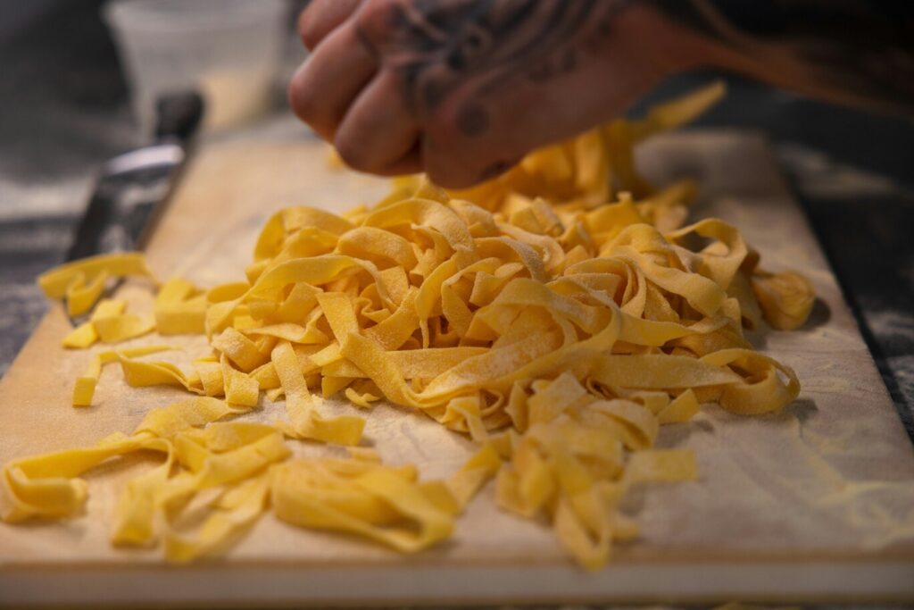 Authentic Italian pasta crafted by a skilled chef, showcasing traditional techniques and rich, homemade flavours in every strand