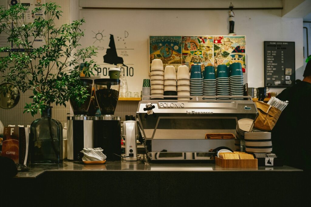 A coffee shop interior, creating an inviting atmosphere for coffee lovers. The shop showcases a wide selection of specialty coffee, including freshly roasted beans and filter brews, perfect for those seeking a great coffee experience in Singapore.