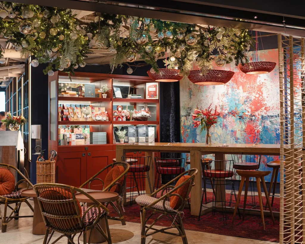 The interior of Wild Honey café at Mandarin Gallery, featuring warm lighting, wooden accents, and a stylish dining layout that blends comfort with elegance