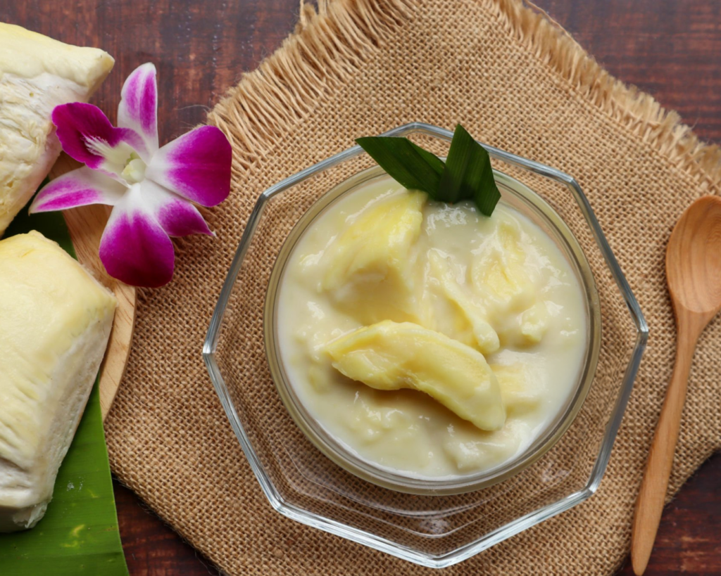 A chilled bowl of durian sago, featuring creamy durian purée with soft sago pearls for a rich and aromatic Asian dessert experience.