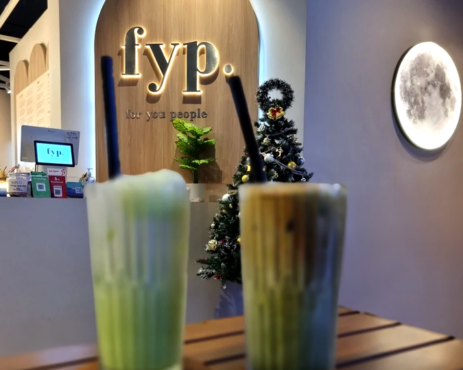 The interior of FYP Café with minimalist décor, clean modern furniture, and soft lighting that creates a relaxed, contemporary atmosphere