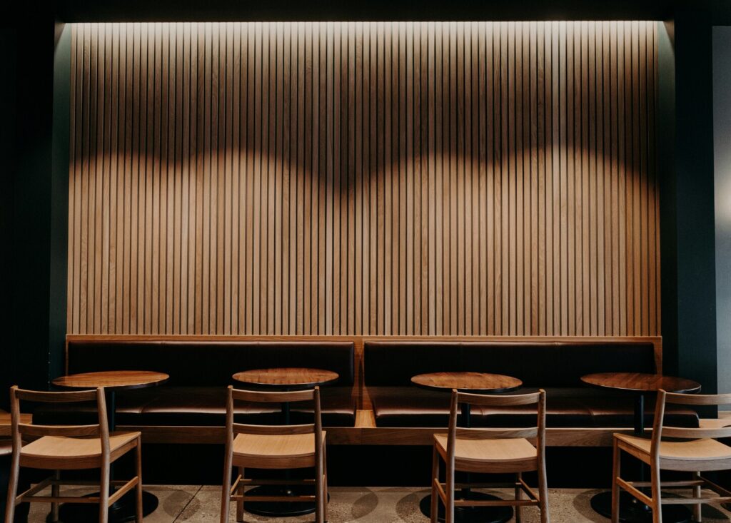 A serene kaiseki restaurant interior with warm lighting, wooden accents, and an elegant setting designed for an authentic multi-course Japanese dining experience.