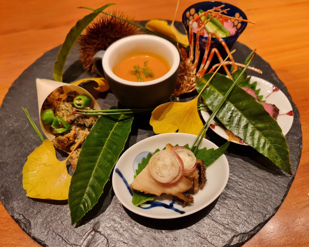 A luxurious Ushidoki Wagyu Kaiseki dish featuring tender slices of premium wagyu beef prepared with meticulous craftsmanship and presented on a minimalist Japanese plate.