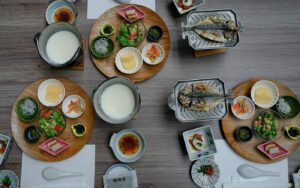 A beautifully plated kaiseki dish presented in a traditional Japanese dining setting, featuring seasonal ingredients arranged with refined precision.