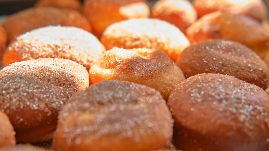 Fluffy brioche doughnuts dusted with sugar, soft on the inside with a rich buttery flavour that melts in every bite.