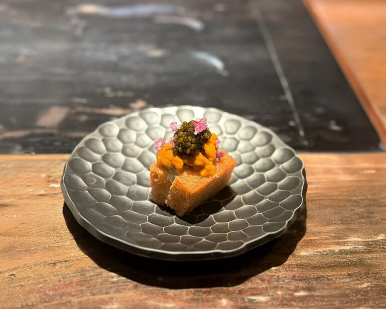 An artfully presented dish at Burnt Ends Restaurant, thoughtfully plated with refined details that showcase balance, texture, and the restaurant’s signature modern barbecue style.