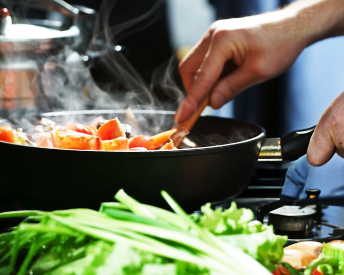 A chef’s steady hands craft each dish with quiet precision, capturing the artistry and focus behind every carefully prepared course.