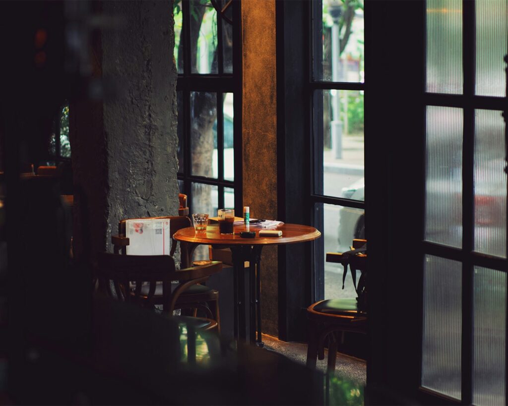 Collection of stylish cafés with unique interiors and plated drinks, highlighting fresh and modern café experiences.