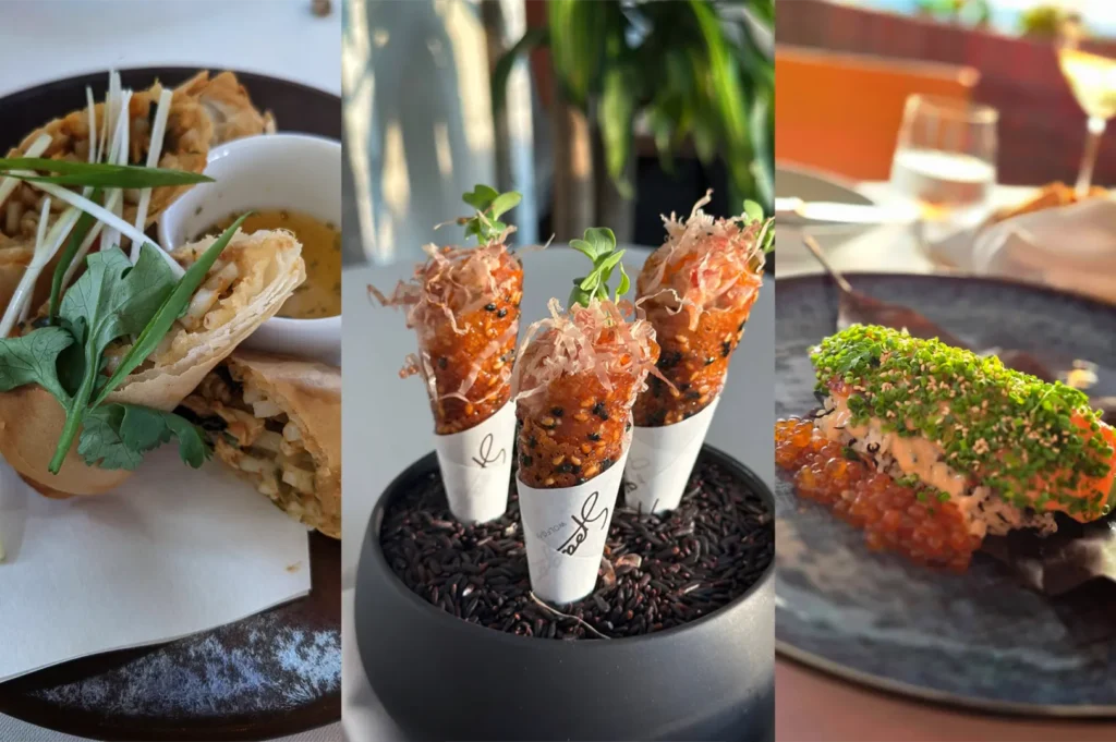 A close-up triptych image captures three beautifully plated, gourmet appetizers. On the left pane, golden, crispy spring rolls are cut diagonally and stacked on a dark plate, garnished with julienned scallions and fresh herbs next to a small white bowl of dipping sauce. The center pane features three miniature, cone-shaped sesame snacks wrapped in white paper sleeves, standing upright in a small black bowl filled with dark grains and topped with delicate microgreens and bonito flakes. The right pane shows a rolled sushi or seafood dish on a dark ceramic plate, heavily topped with finely chopped chives, sesame seeds, and a generous layer of glistening orange fish roe along the side, set against a softly blurred restaurant background.